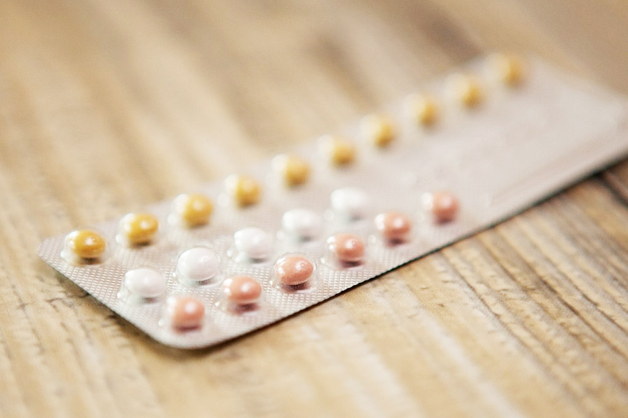 A closeup of pills on a table.